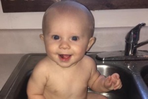 image of baby in sink. Babies are precious to their parents